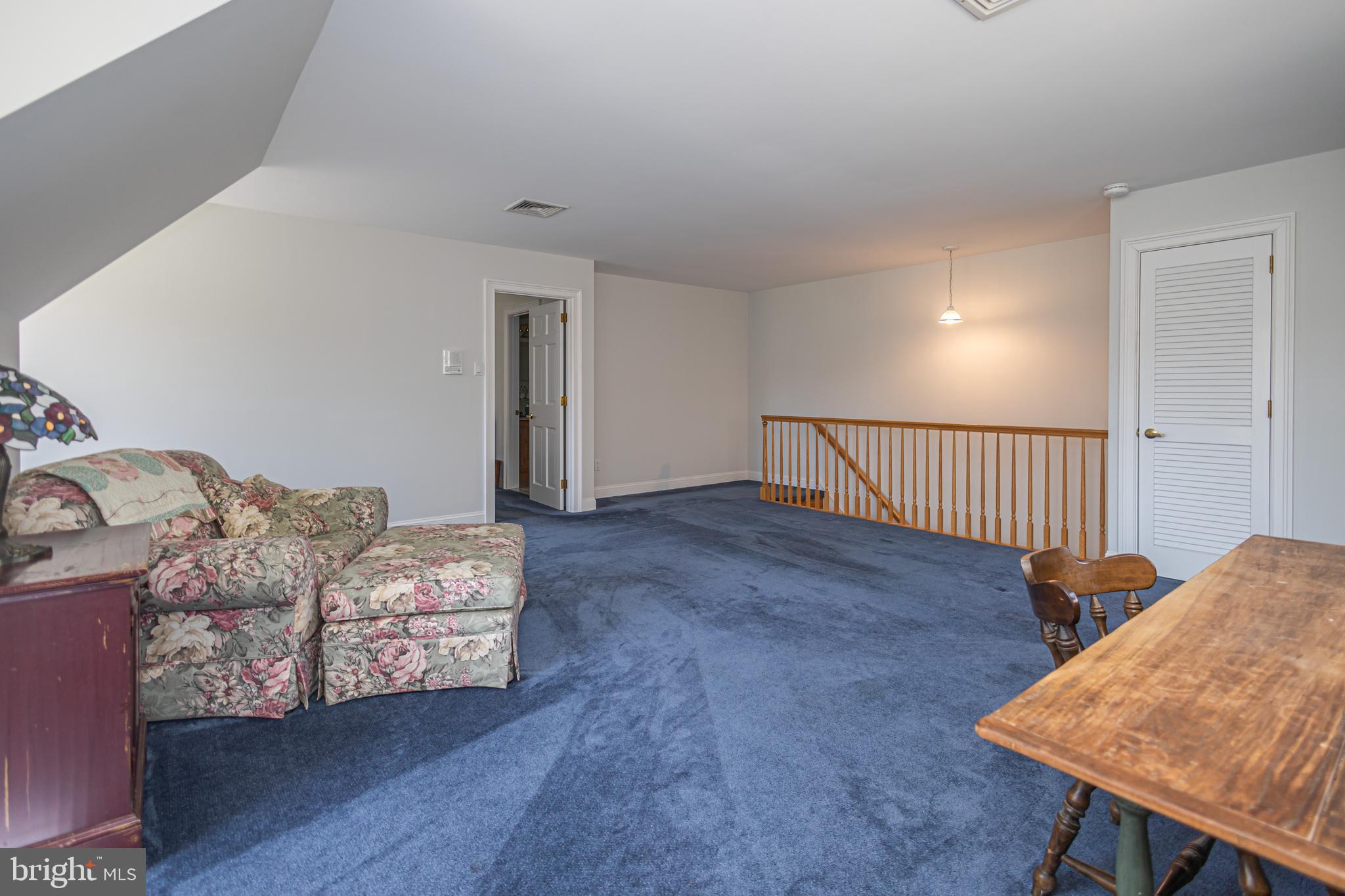 1045 Washington Crossing Road Newtown, PA 18940 - Photo 38 of 67 a living room with furniture and a wooden floor