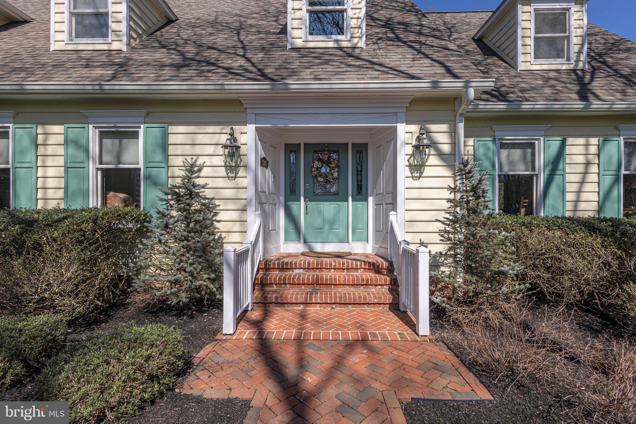 1045 Washington Crossing Road Newtown, PA 18940 - Photo 5 of 67 a front view of a house with a garden