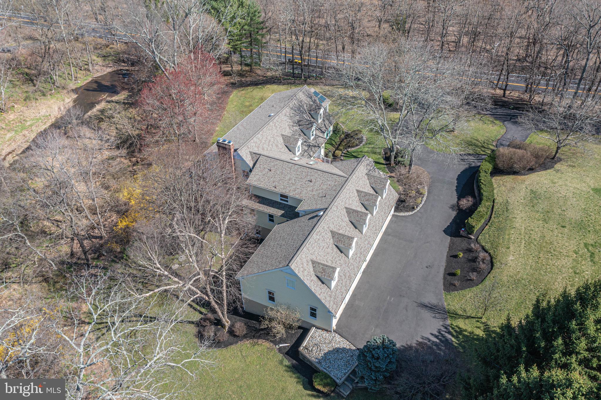 1045 Washington Crossing Road Newtown, PA 18940 - Photo 57 of 67 an aerial view of a house with outdoor space and a lake view