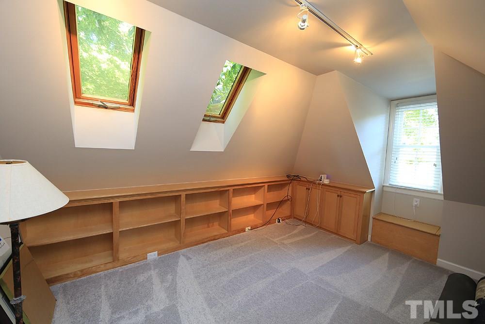 1901 Russell Drive Raleigh, NC 27612 - Photo 14 of 18 Bonus/Office with skylights, bookshelves, new carpet and ceiling fan.