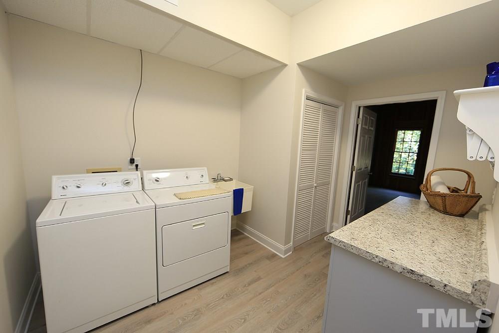 1901 Russell Drive Raleigh, NC 27612 - Photo 15 of 18 Laundry Room with sink and cabinets.