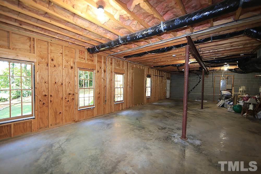 1901 Russell Drive Raleigh, NC 27612 - Photo 16 of 18 Full unfinished walk-out basement offers ample opportunity for expansion or storage.