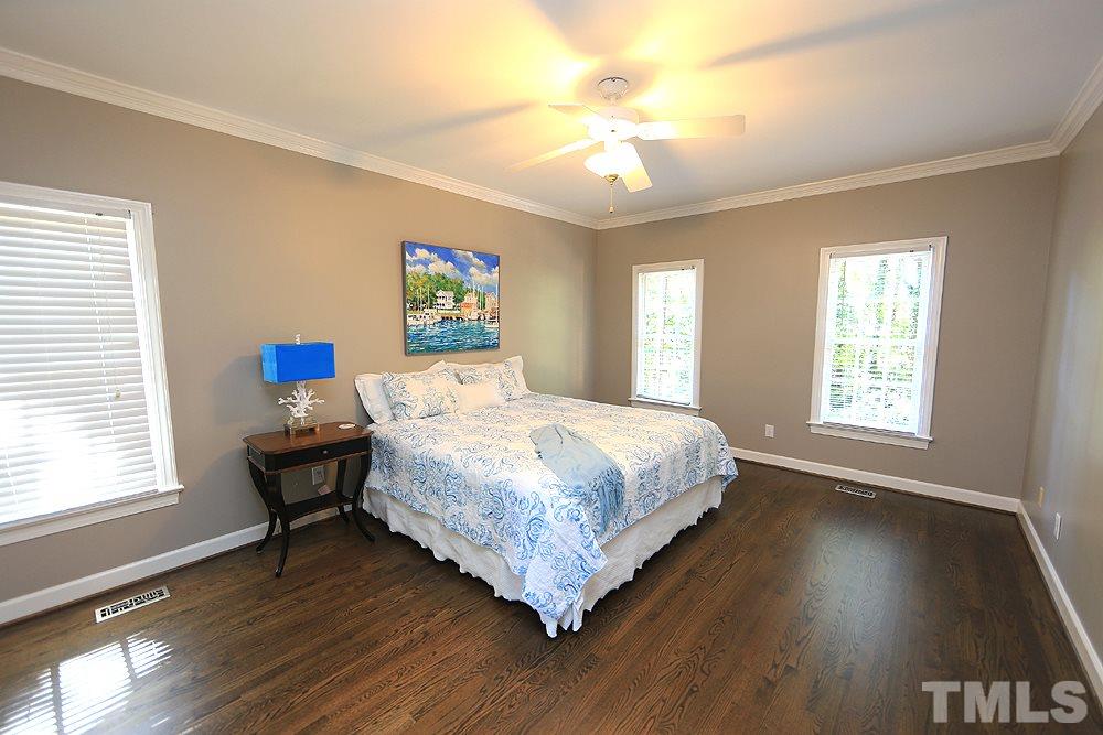 1901 Russell Drive Raleigh, NC 27612 - Photo 9 of 18 1st Floor Master with ceiling fan and refinished hardwood floors.