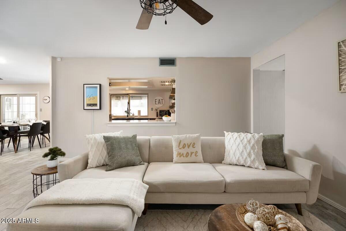 922 West Monte Avenue Mesa, AZ 85210 - Photo 11 of 41 a living room with furniture and a large window