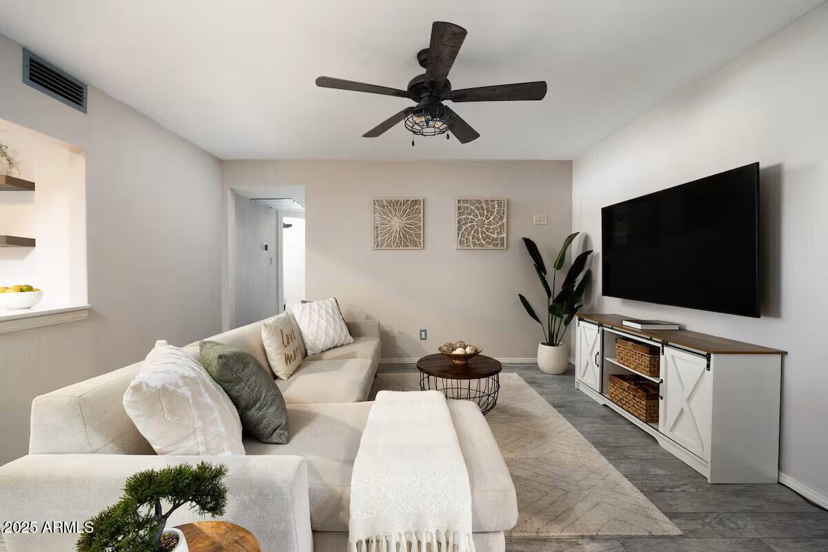 922 West Monte Avenue Mesa, AZ 85210 - Photo 14 of 41 a living room with furniture and a flat screen tv