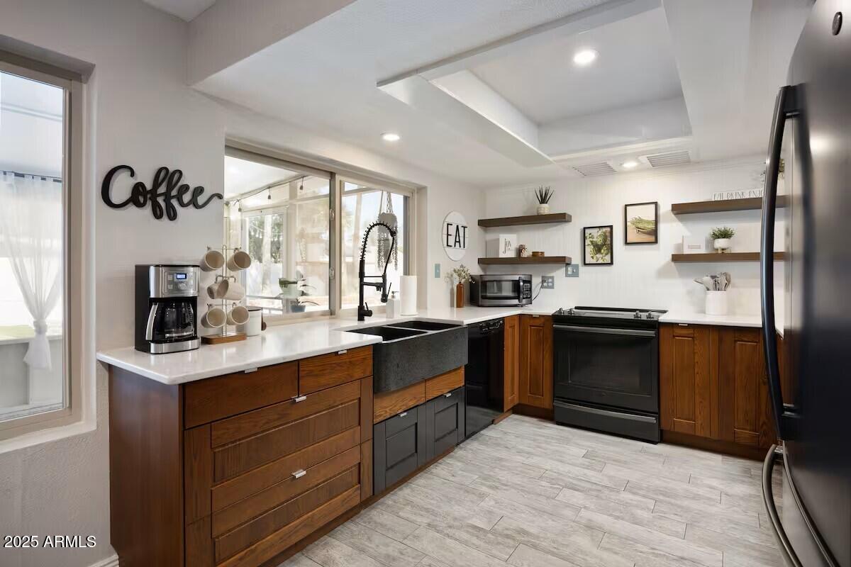 922 West Monte Avenue Mesa, AZ 85210 - Photo 18 of 41 a kitchen with a sink stove and refrigerator