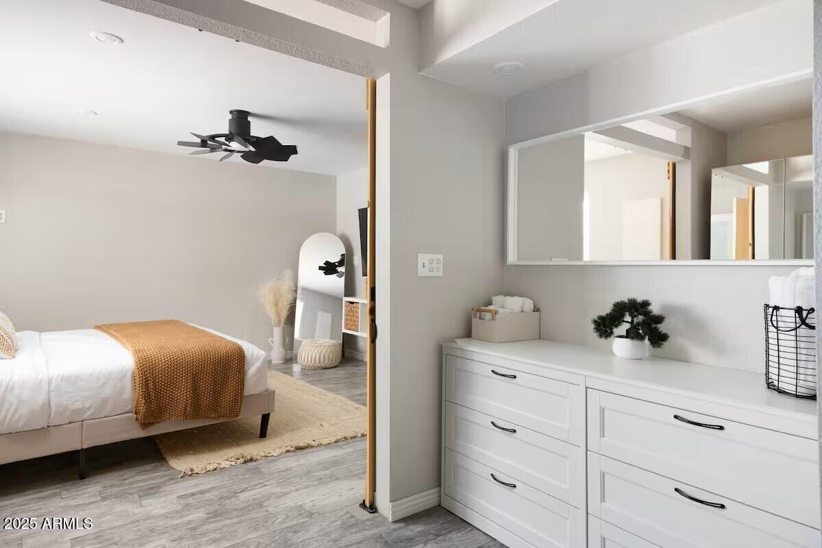 922 West Monte Avenue Mesa, AZ 85210 - Photo 26 of 41 a bedroom with a bed and a cabinets