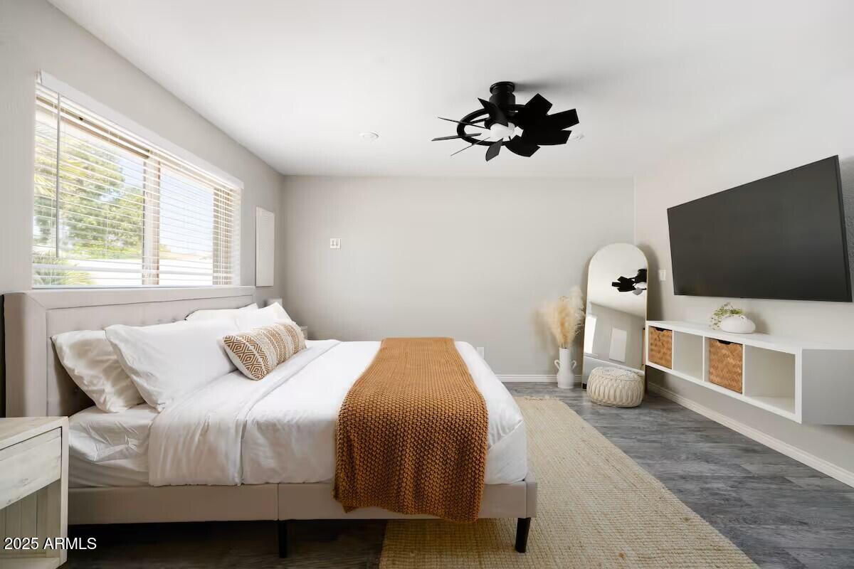 922 West Monte Avenue Mesa, AZ 85210 - Photo 34 of 41 a bedroom with a bed and a flat screen tv