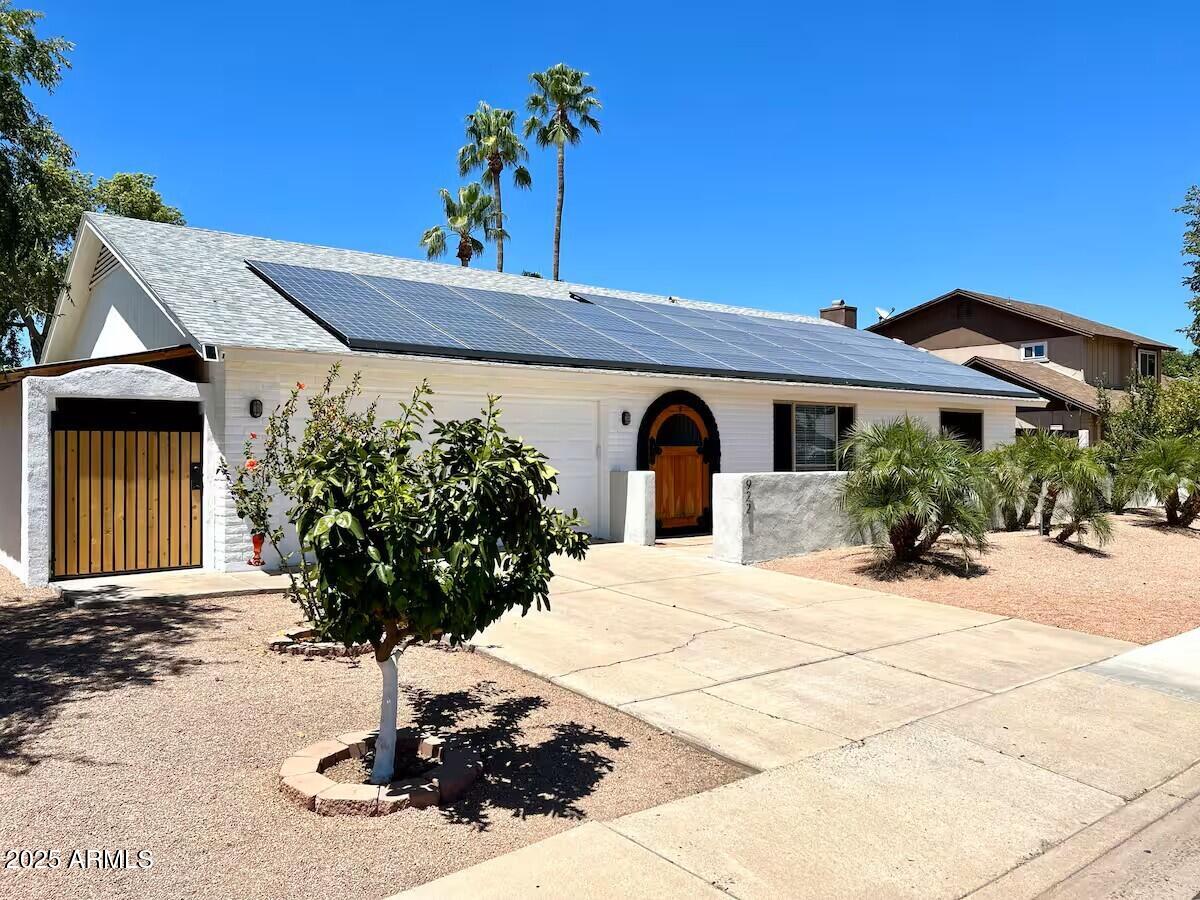 922 West Monte Avenue Mesa, AZ 85210 - Photo 4 of 41 a view of a house with potted plants