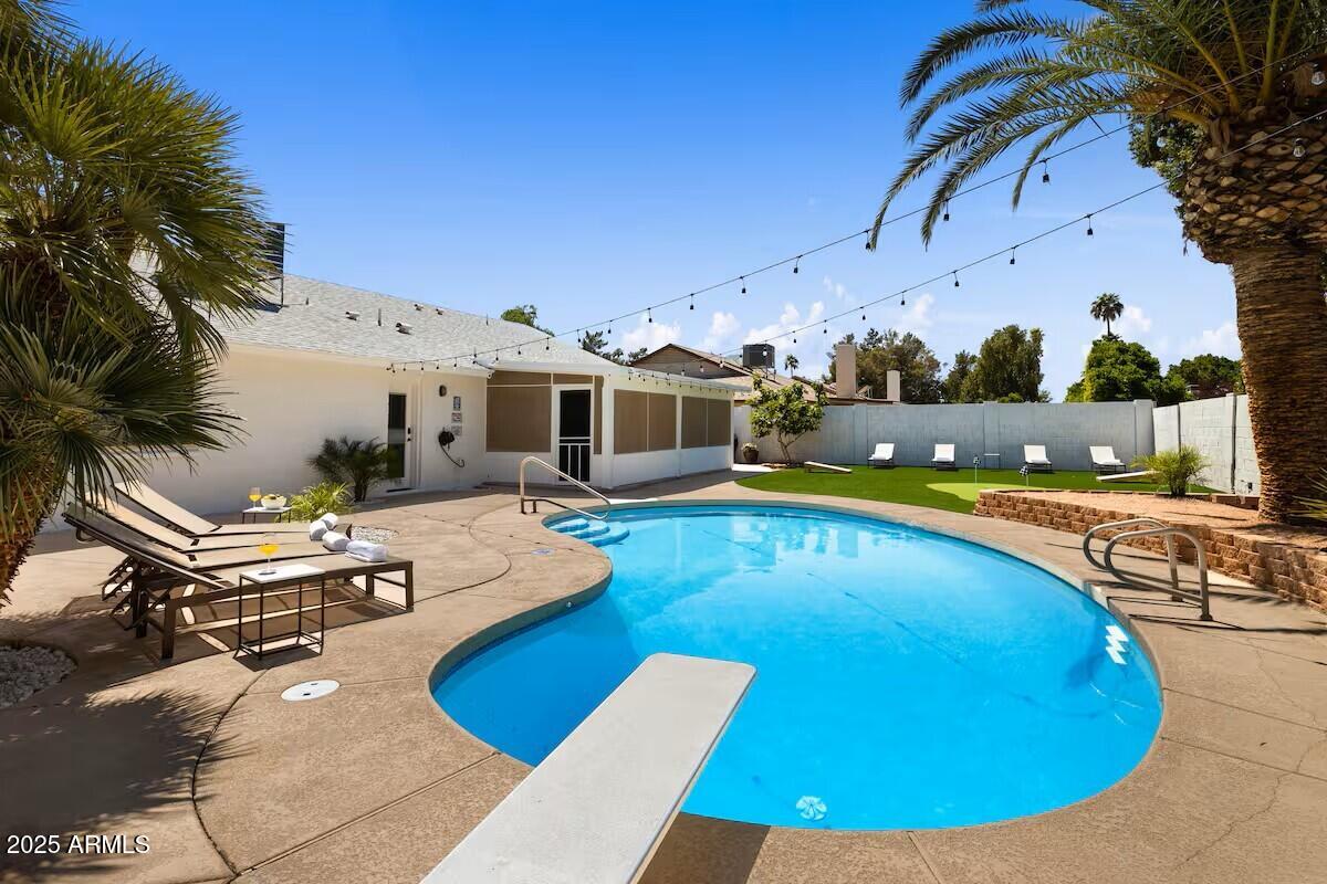 922 West Monte Avenue Mesa, AZ 85210 - Photo 5 of 41 a view of a swimming pool with lounge chairs