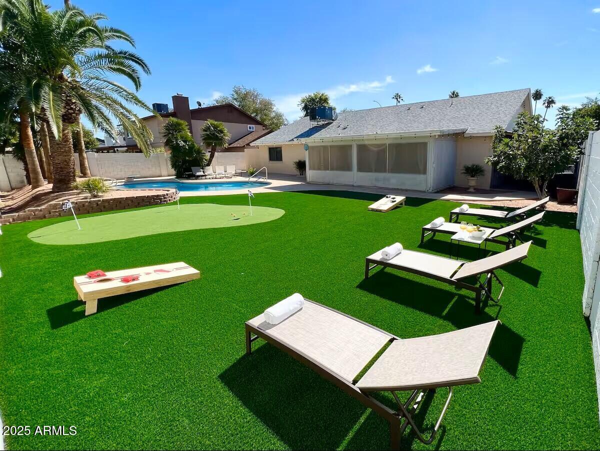 922 West Monte Avenue Mesa, AZ 85210 - Photo 6 of 41 a view of a house with a backyard patio and swimming pool
