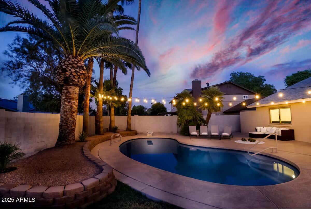 922 West Monte Avenue Mesa, AZ 85210 - Photo 7 of 41 a view of a swimming pool with an outdoor seating