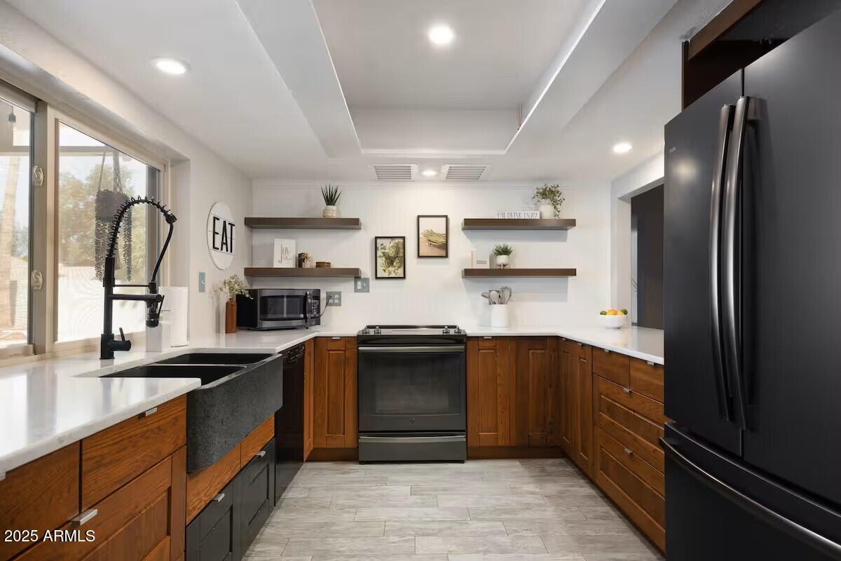 922 West Monte Avenue Mesa, AZ 85210 - Photo 8 of 41 a kitchen with stainless steel appliances granite countertop a sink stove and refrigerator