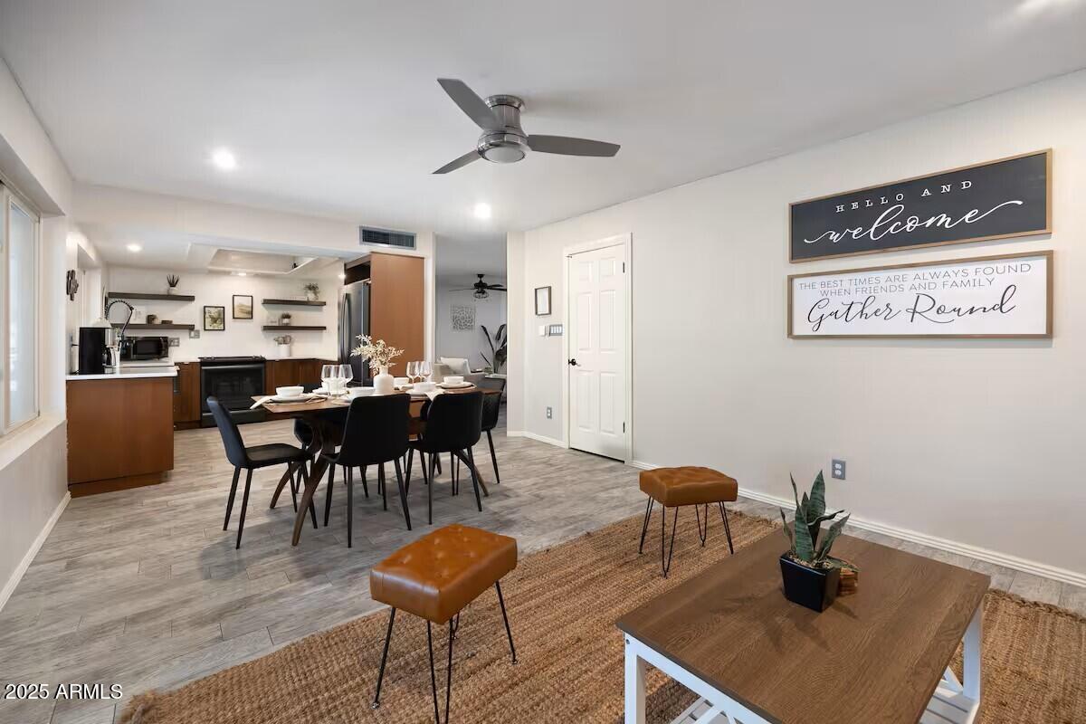 922 West Monte Avenue Mesa, AZ 85210 - Photo 10 of 41 a kitchen with a dining table chairs and view living room