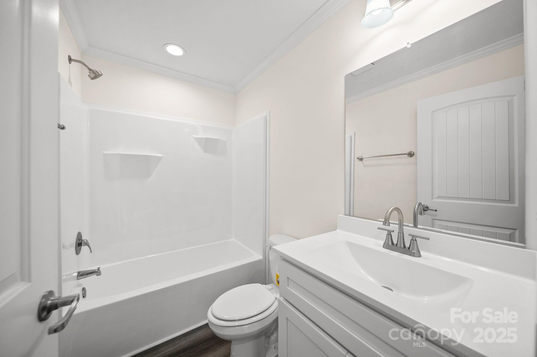 159 Hallman Street Cherryville, NC 28021 - Photo 18 of 22 a bathroom with a sink a toilet and a bathtub