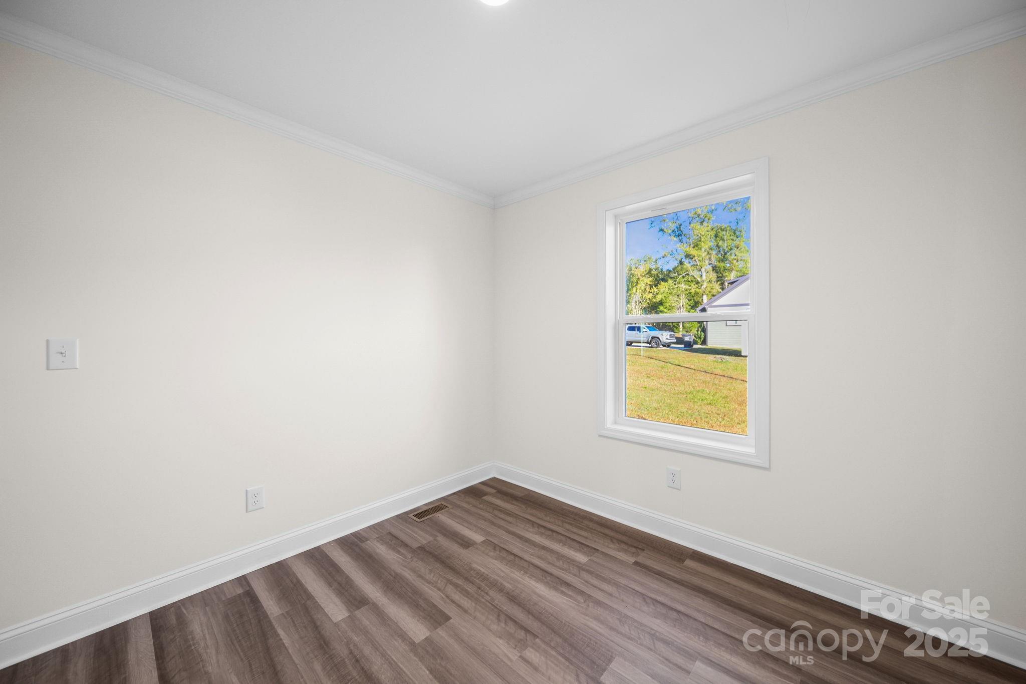 159 Hallman Street Cherryville, NC 28021 - Photo 21 of 22 an empty room with a window