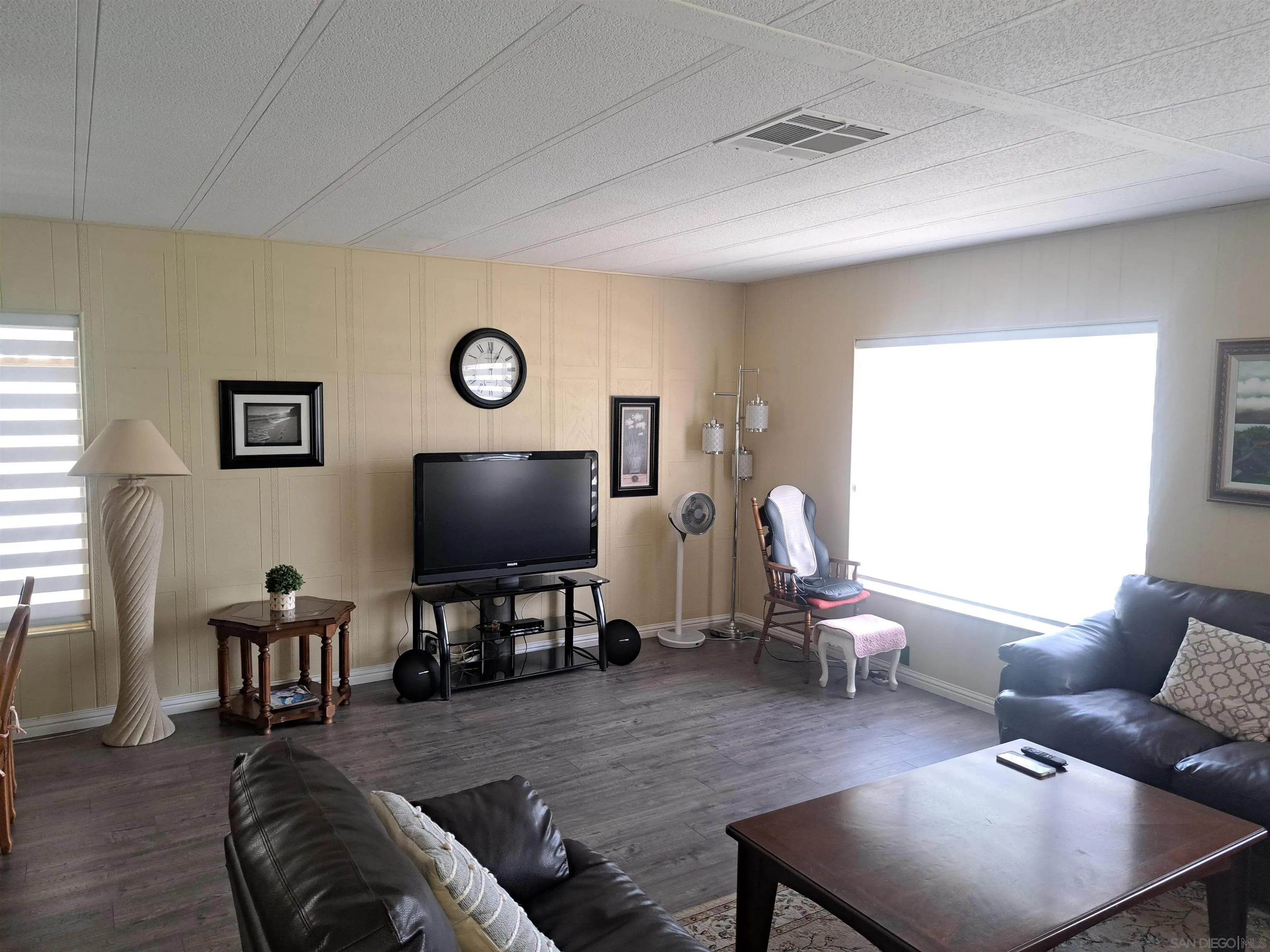 4650 Dulin Road, Unit 12 Fallbrook, CA 92003 - Photo 12 of 36 a living room with furniture and a flat screen tv