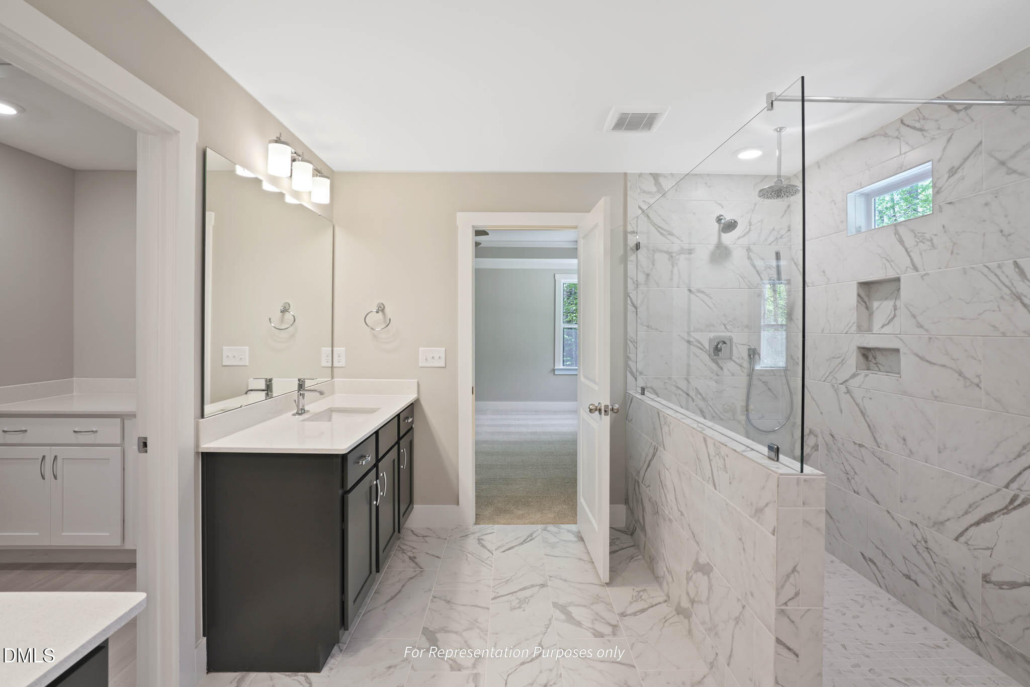 8924 Brook Trout Lane Willow Spring, NC 27592 - Photo 15 of 16 a bathroom with a double vanity sink mirror and shower
