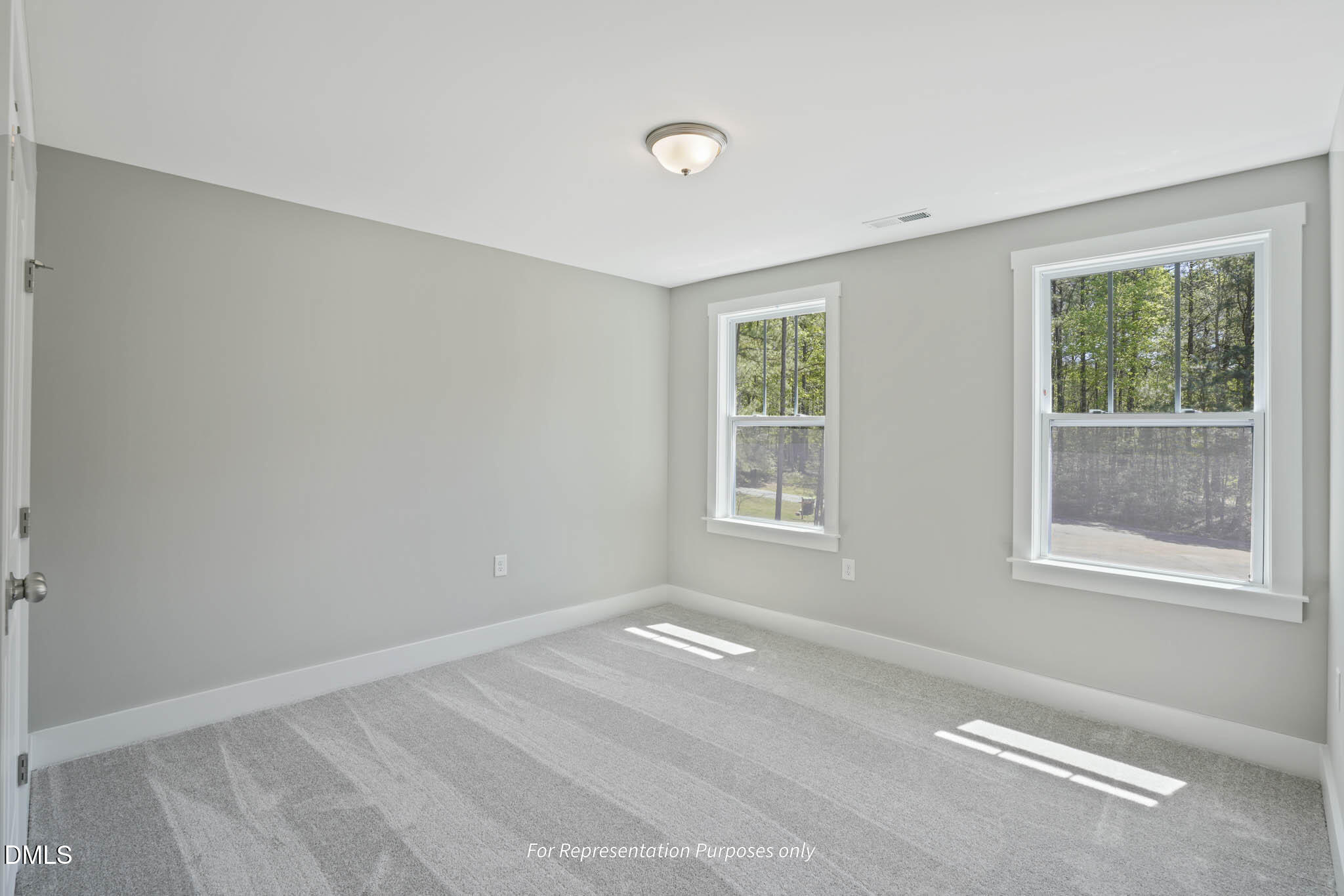 8924 Brook Trout Lane Willow Spring, NC 27592 - Photo 16 of 16 an empty room with windows