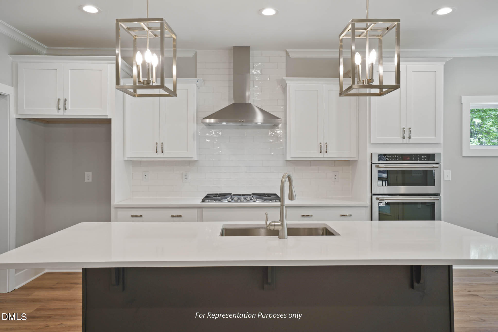 8924 Brook Trout Lane Willow Spring, NC 27592 - Photo 5 of 16 a kitchen with stainless steel appliances a sink and cabinets