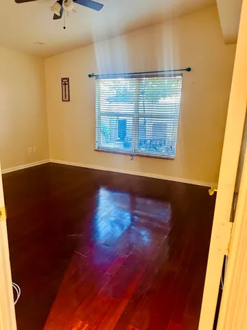 a bathroom with a granite countertop sink a toilet and bathtub