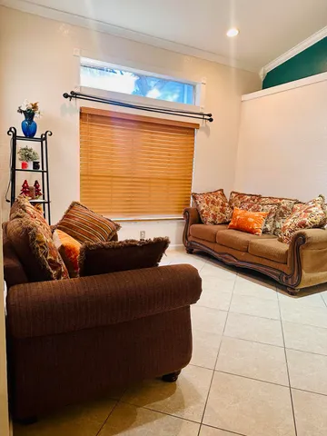 a living room with furniture and a window