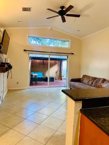 a living room with a couch and a rug