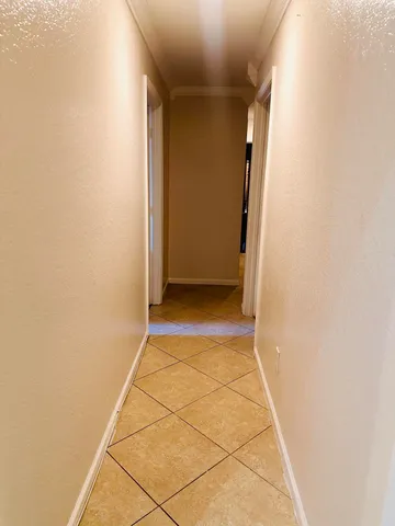 a bathroom with a granite countertop toilet and a sink