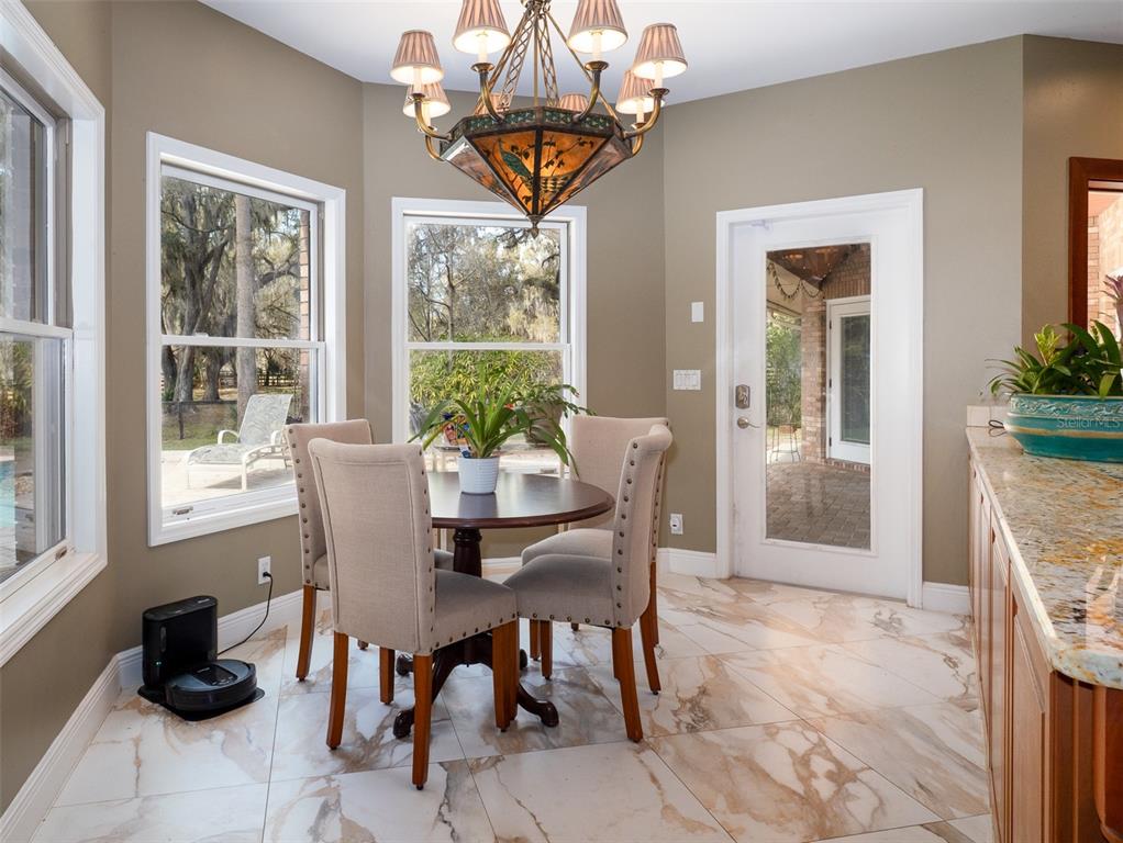 4986 Southwest 7th Avenue Road Ocala, FL 34471 - Photo 12 of 39 a dining room with furniture and window