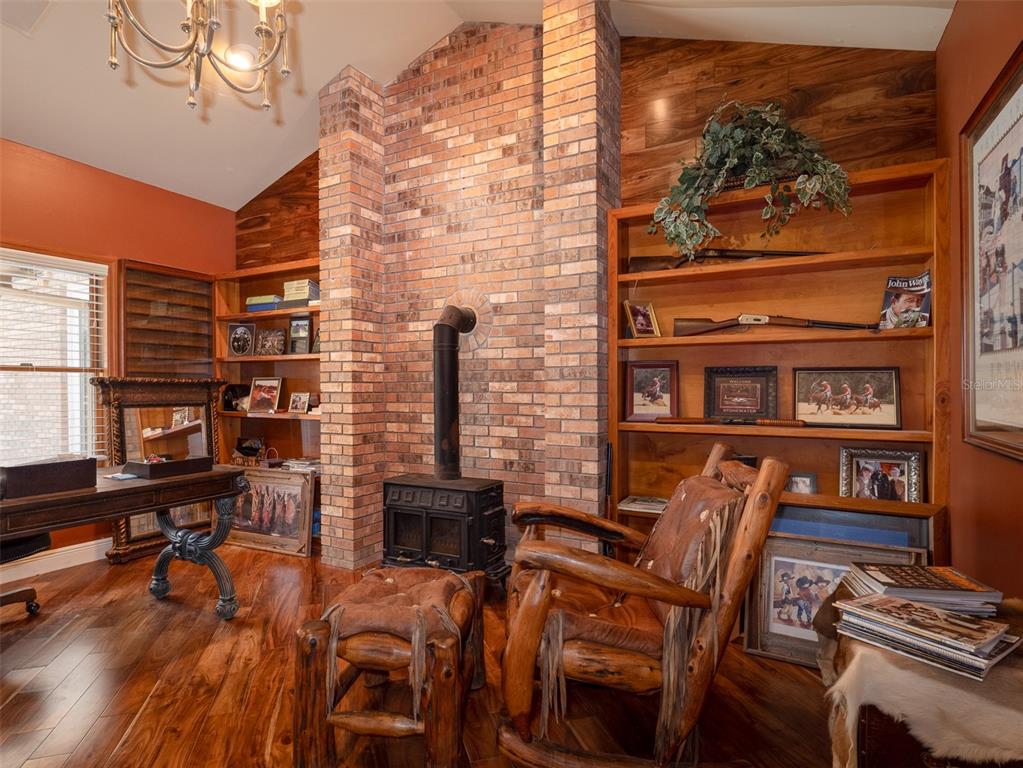 4986 Southwest 7th Avenue Road Ocala, FL 34471 - Photo 16 of 39 a view of a dining room with furniture and wooden floor