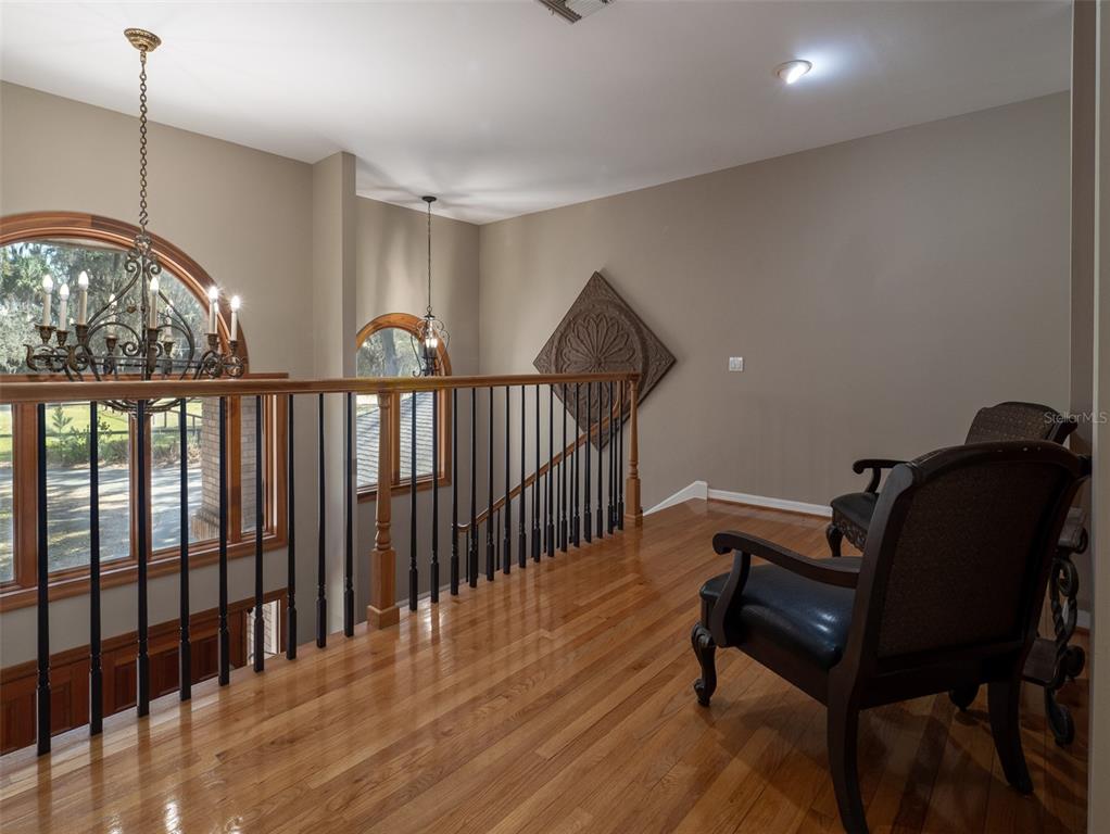 4986 Southwest 7th Avenue Road Ocala, FL 34471 - Photo 19 of 39 a living room with furniture a table and a chandelier