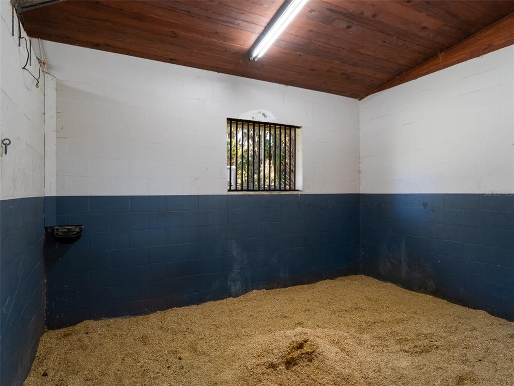 4986 Southwest 7th Avenue Road Ocala, FL 34471 - Photo 34 of 39 a bed room with a bed