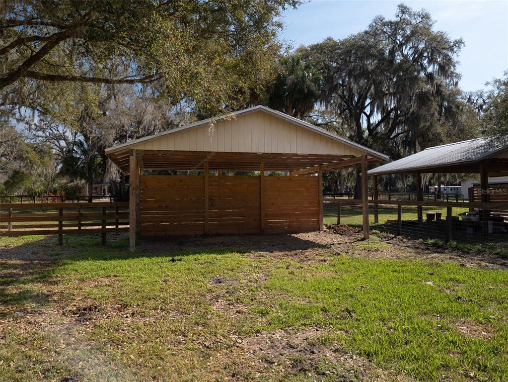 4986 Southwest 7th Avenue Road Ocala, FL 34471 - Photo 36 of 39 a view of a house with a yard