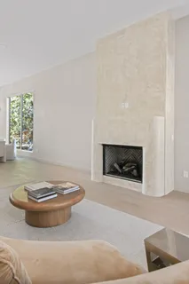 a kitchen with stainless steel appliances a stove and white cabinets