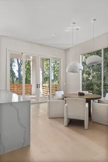 a kitchen with stainless steel appliances a stove sink and cabinets