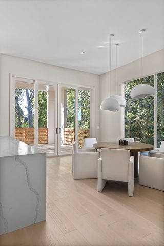 a kitchen with stainless steel appliances a stove sink and cabinets