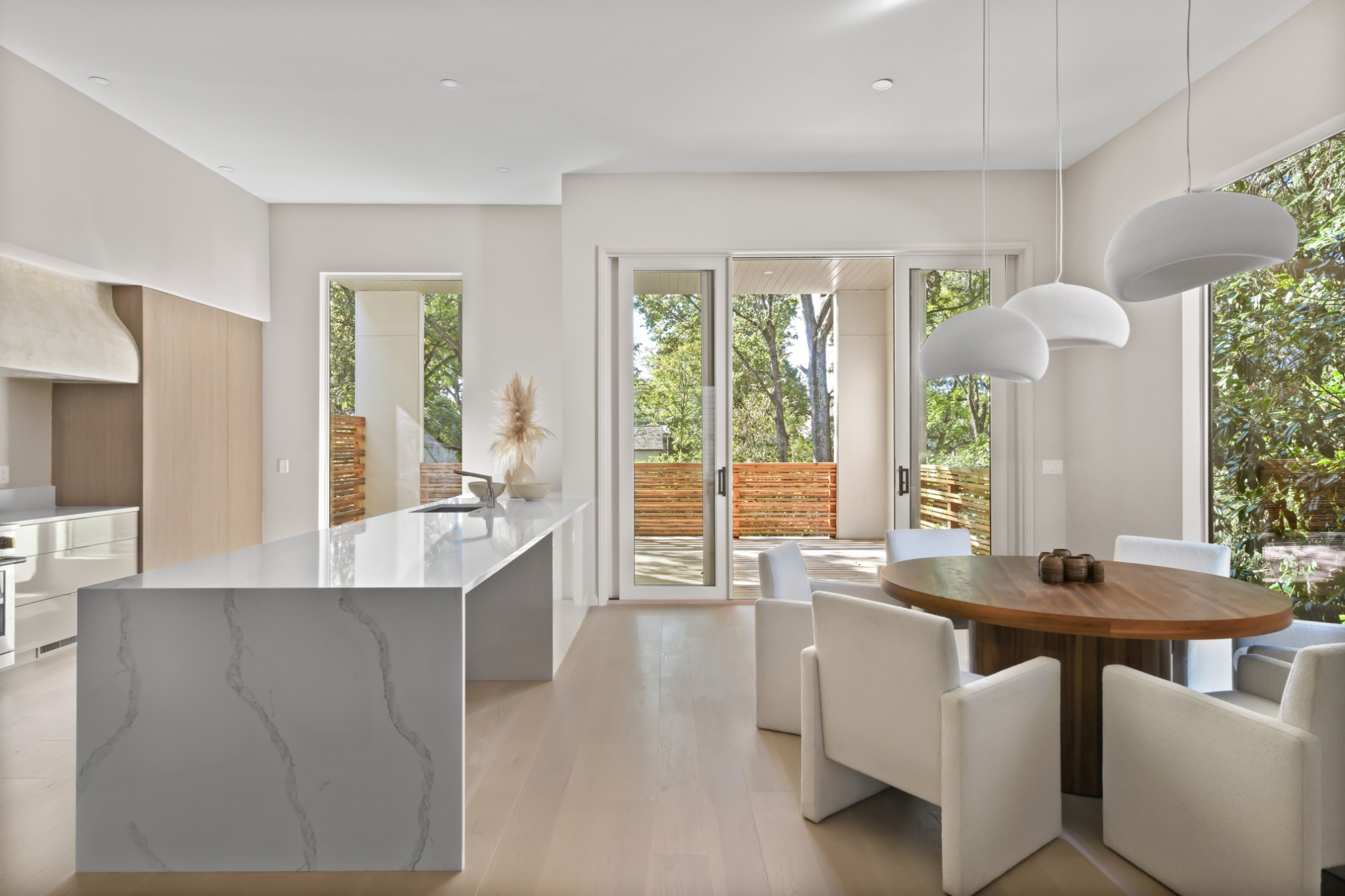 3707 A Woodmont Boulevard Nashville, TN 37215 - Photo 19 of 56 a dining hall with stainless steel appliances kitchen island granite countertop a refrigerator a sink dishwasher a dining table and chairs with wooden floor