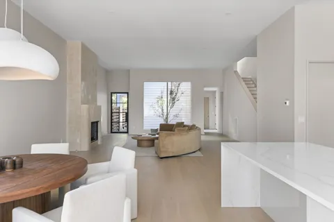 a room with a large bed and chandelier