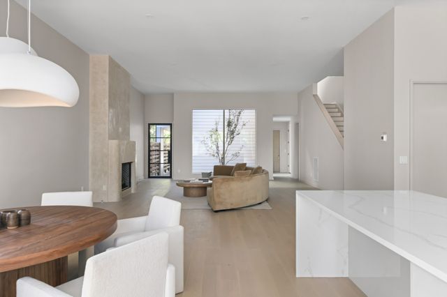 a room with a large bed and chandelier