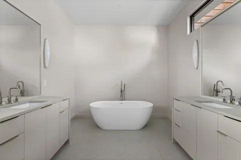 a view of an empty room with a window and balcony