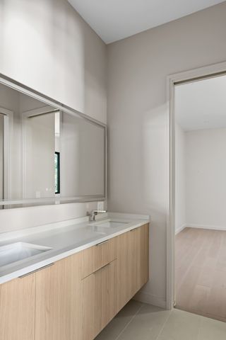 a view of a kitchen with a sink and a refrigerator