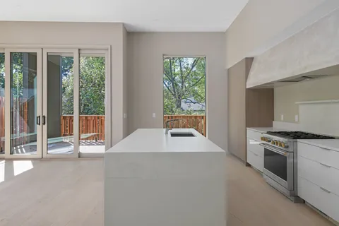 a kitchen with a stove and a sink
