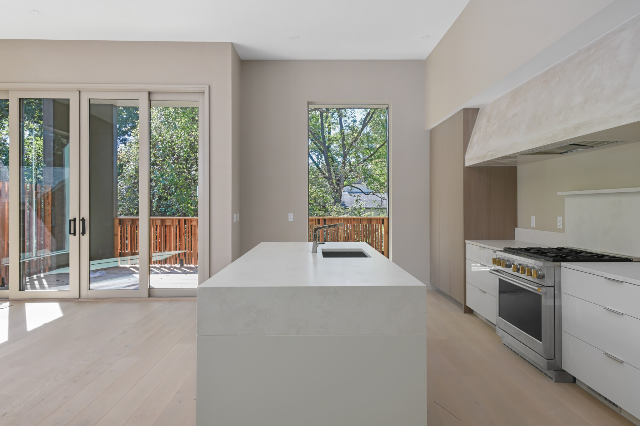 3707 A Woodmont Boulevard Nashville, TN 37215 - Photo 50 of 56 a kitchen with a stove a sink and a dining table with garden view