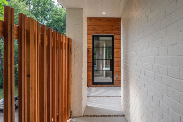 a view of a wooden door with outside view