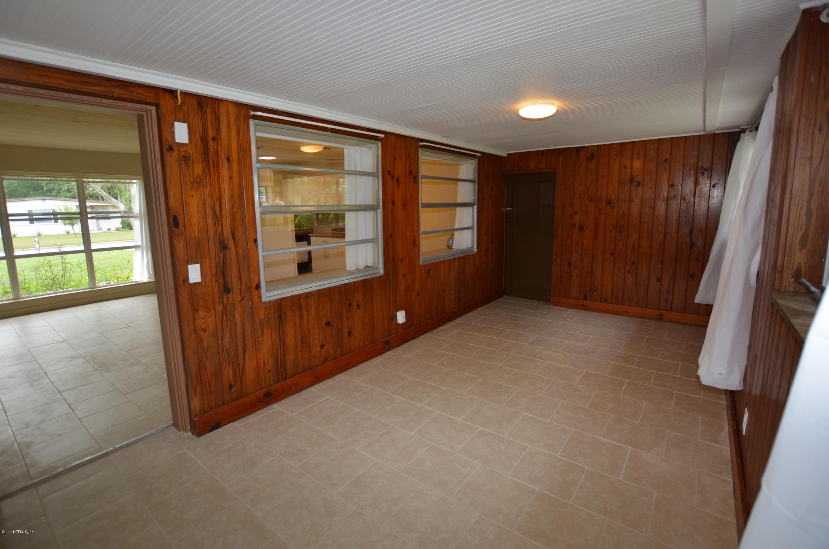 2963 Alonso Road Jacksonville, FL 32216 - Photo 19 of 22 Florida room with family room view