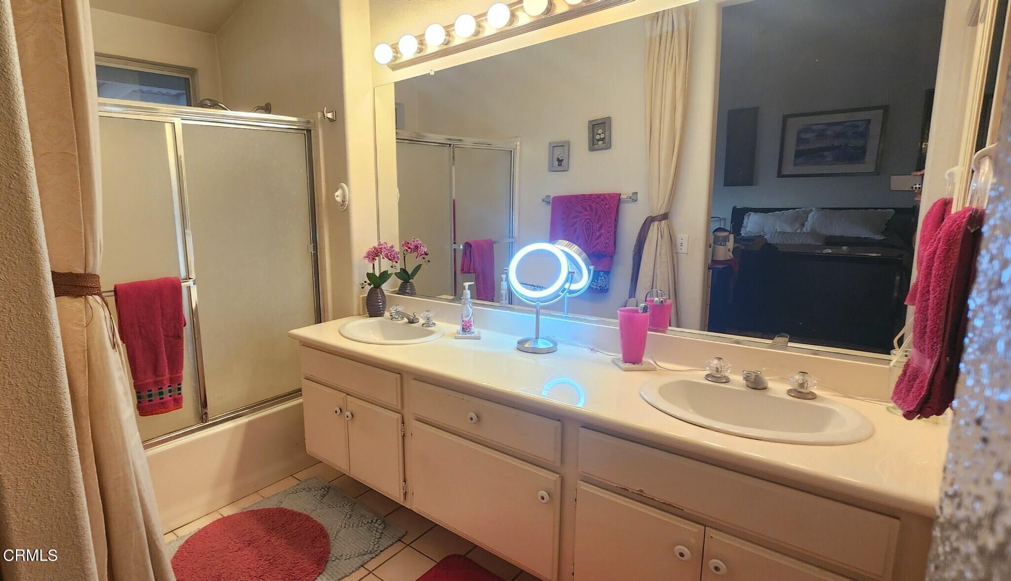 1500 Gabriella Drive Oxnard, CA 93030 - Photo 13 of 23 a bathroom with a sink vanity mirror and toilet
