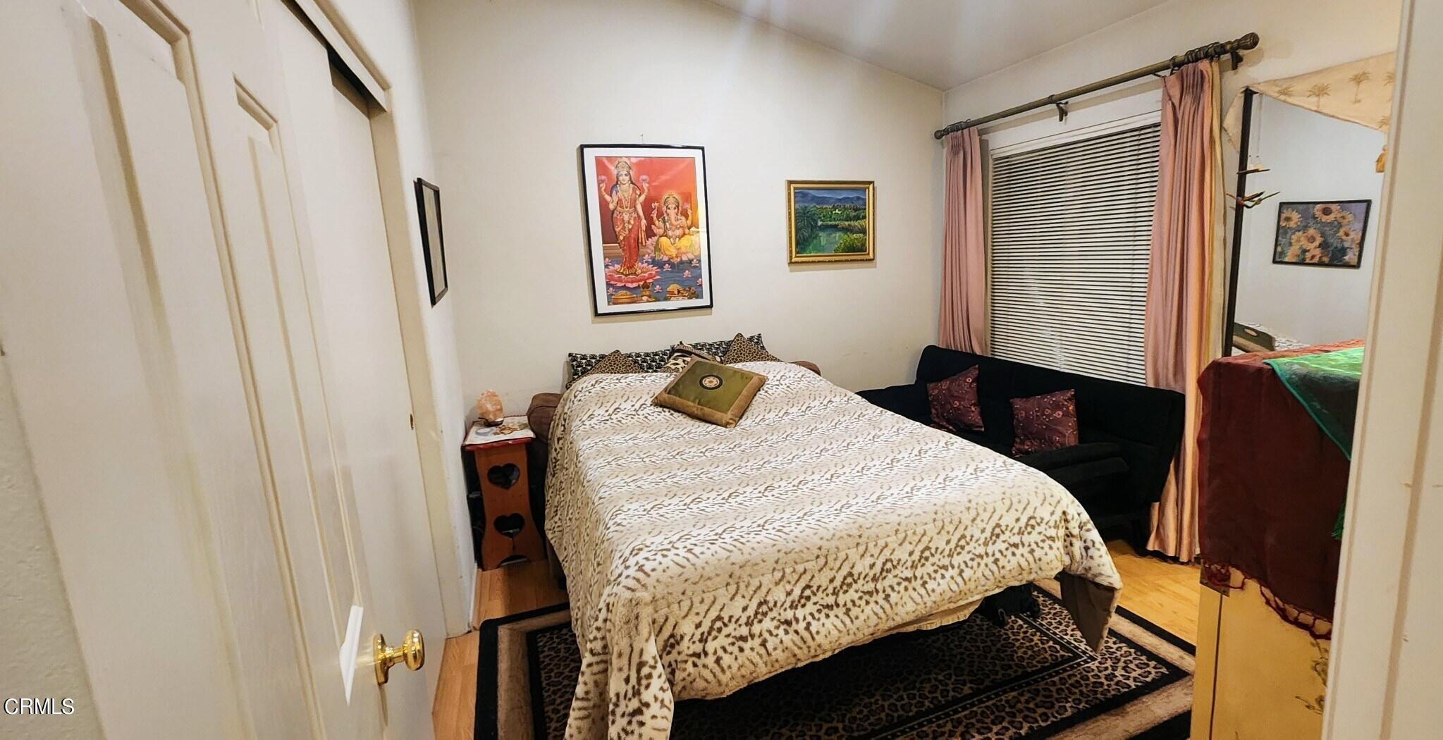 1500 Gabriella Drive Oxnard, CA 93030 - Photo 15 of 23 a bedroom with a bed and wooden floor