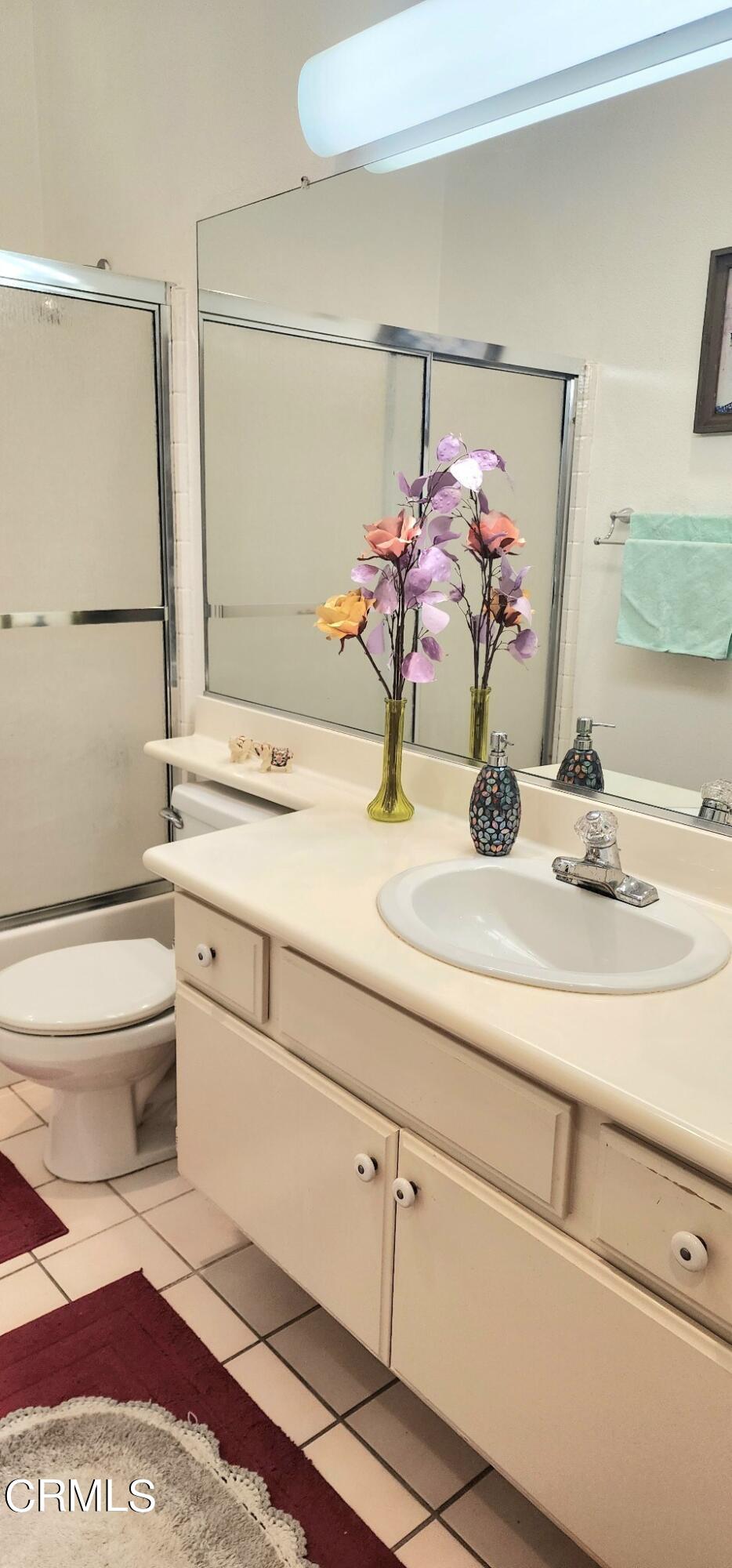 1500 Gabriella Drive Oxnard, CA 93030 - Photo 18 of 23 a bathroom with a sink and a mirror