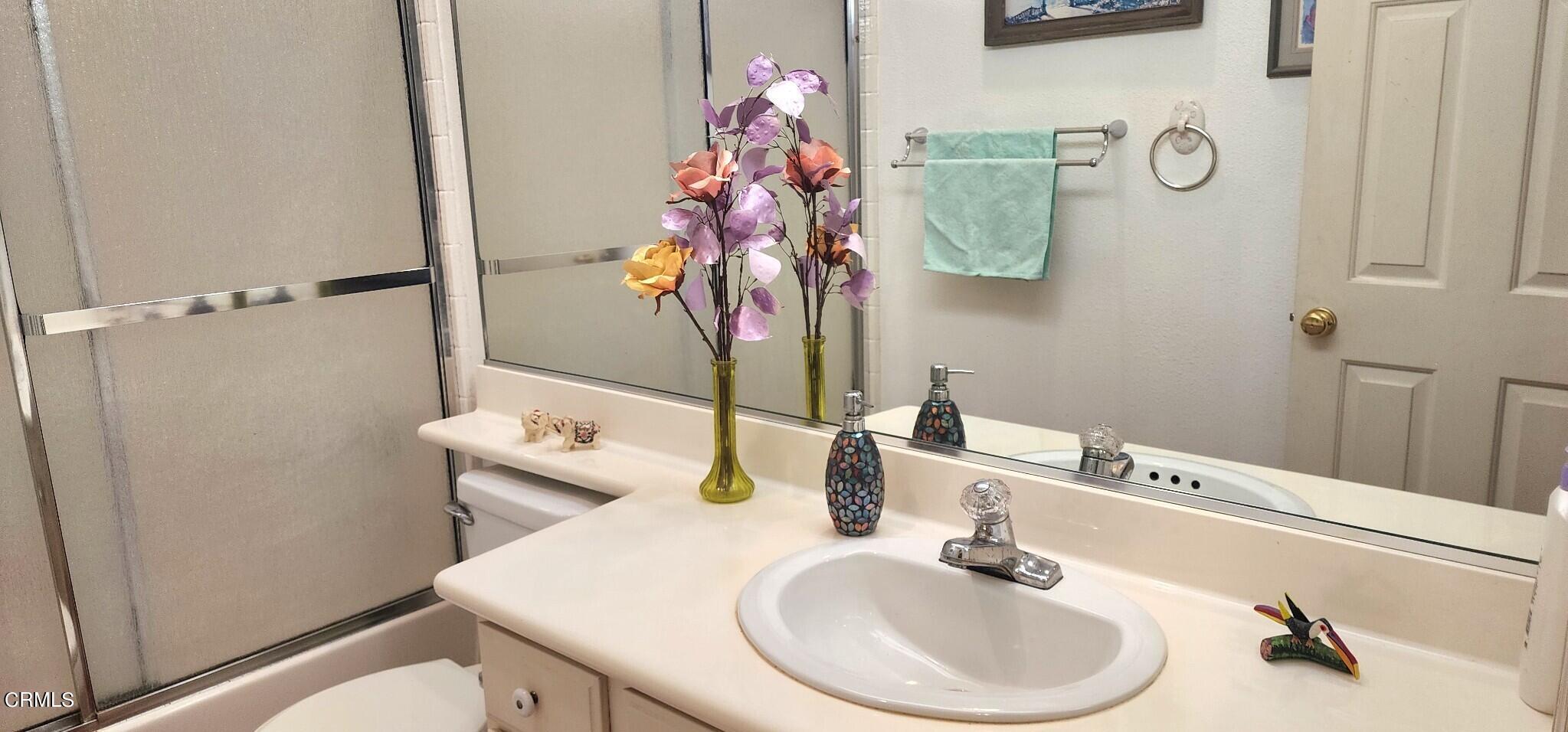 1500 Gabriella Drive Oxnard, CA 93030 - Photo 19 of 23 a bathroom with a sink toilet and mirror