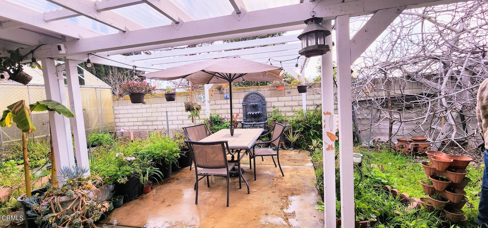 1500 Gabriella Drive Oxnard, CA 93030 - Photo 23 of 23 a patio with table and chairs and potted plants
